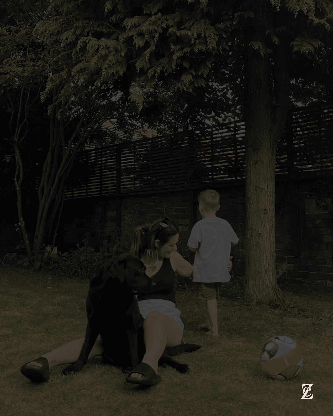 Business owner mum + website copywriter with dog and child in garden